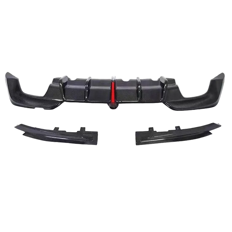 A carbon fiber rear bumper lip kit with a central diffuser and two lower lip sections, displayed on a white background.