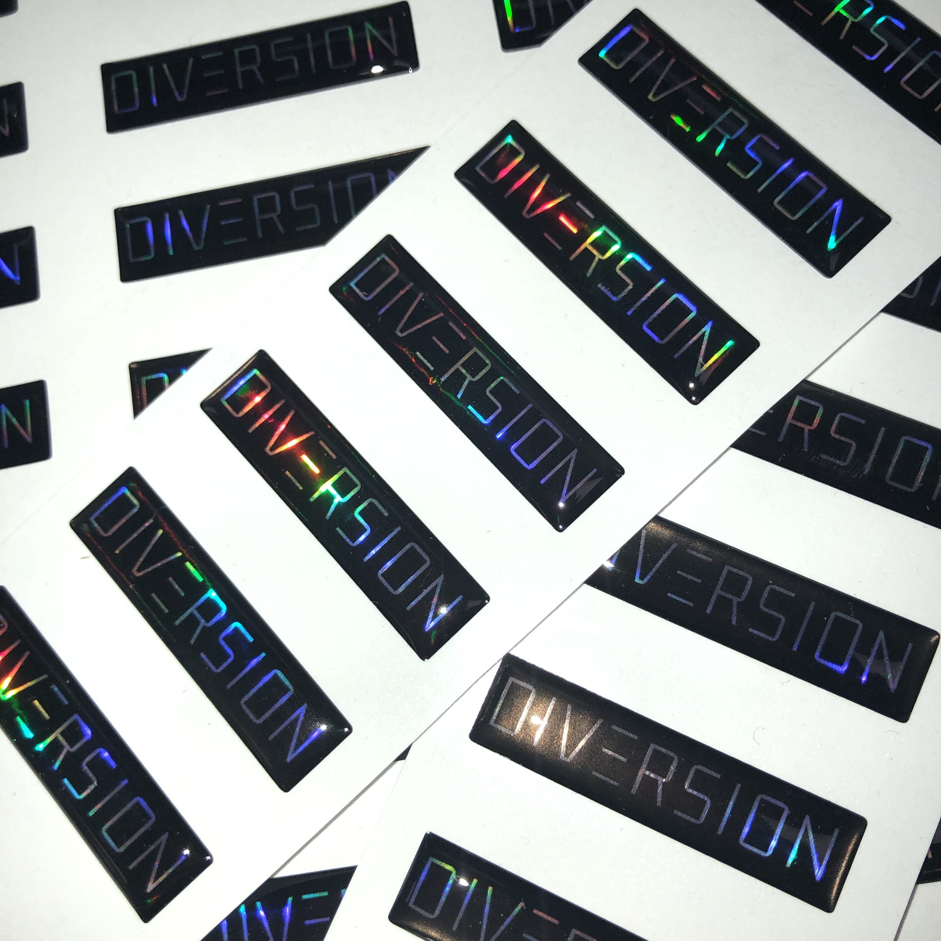DIVERSION Neo Chrome / Oil Slick Domed Gel Badge (4CM x 1CM) gel clear coat sticker decal sticker bomb slap sticker black and chrome performance diversion stores perfect gift